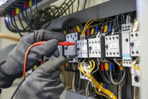 Close-up of contactors and control wiring inside an electrical distribution panel